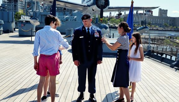Stoltenberg family at a military promotion ceremony. The kids are “pinning on” his new rank.