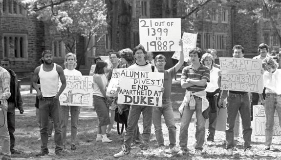 Students holding up protest signs