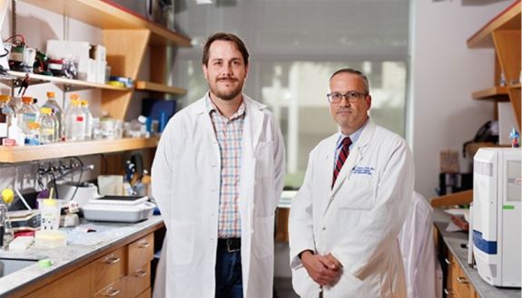 Michael P. Plebanek, PhD, (left), and Brent A. Hanks, MD, PhD