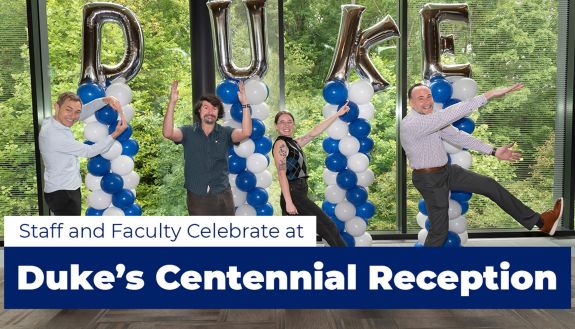 Employees of Duke University spelling out Duke.