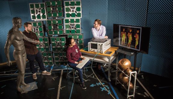 people in lab testing antennas made of meta materials