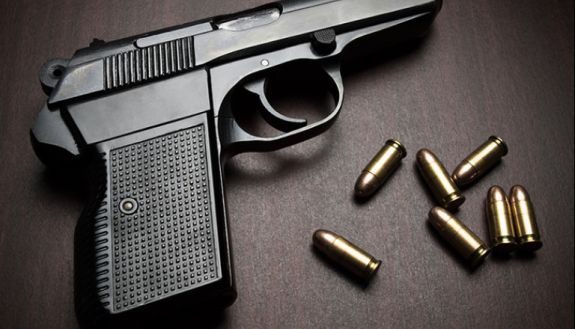 stock image of handgun with bullets