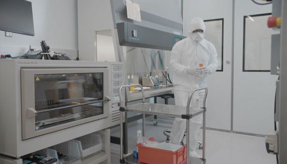 A Duke Human Vaccine Institute researcher working in one of the new vaccine manufacturing labs