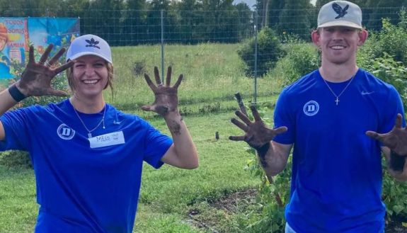 Duke students playing in a field