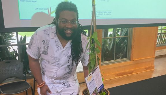 Derek Haynes with a vanilla plant