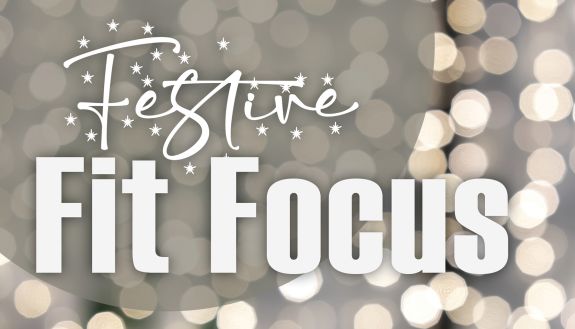 A graphic reads "Festive Fit Focus" with holiday lights in the background.