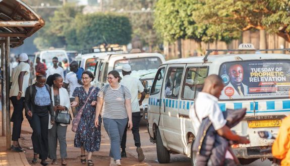 People walking on a busy street in Uganda