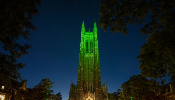 Duke Chapel lit up green for Earth Day 2024.