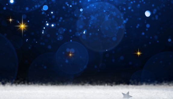 A graphic of a night sky shows twinkling stars