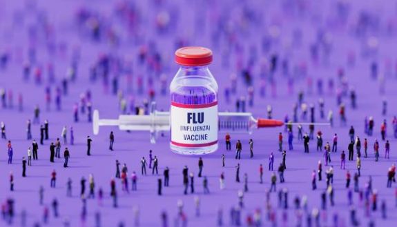 stock image of a flu vaccine with lots of tiny people around it