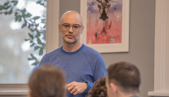Jesse Summers in front of students