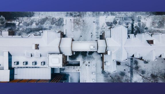 West Campus ariel photo of snowfall