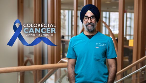 Ajay Kohli, an ER doctor, stands in the Duke Cancer Center