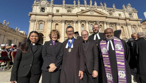 People standing in front of the Vatican