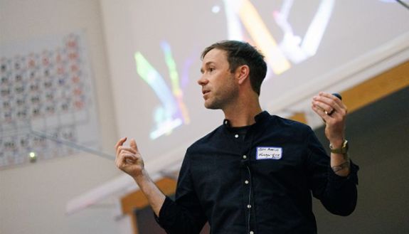 Person talking in front of a whiteboard