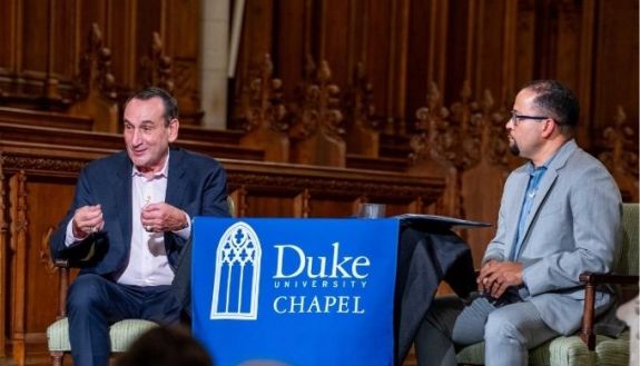 Two people speaking at Duke Chapel