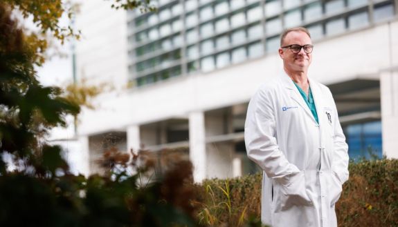 David Powers standing in front of a building