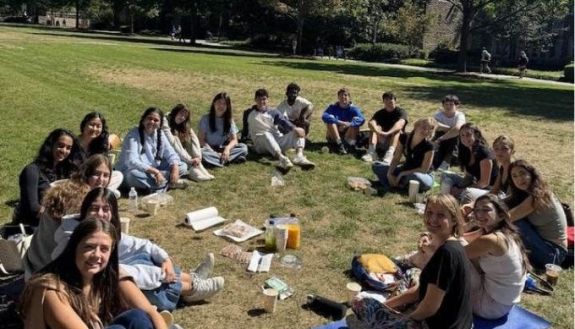 People sitting in a circle on the ground