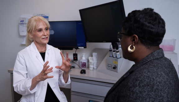 A doctor talking to a patient in an office