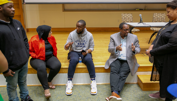 Patrick Douthit and Mark Anthony Neal speaking with students in their “History of Hip Hop” class