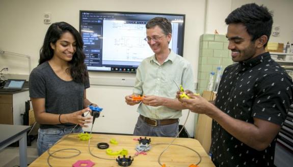 Working on the design of endoscopy dials. From left to right, Lizbeth Leapo (student), Matt Brown (BME lab instructor), Ashish Vankara (student). Photo credits, Chris Hildreth