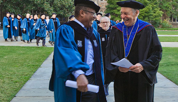Horst Meyer, right, talks with Duke Trustee Daniel Blue Jr. before the 2014 Founders' Day ceremony. Photo: Duke Photography