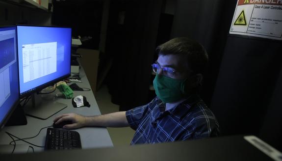 Dr. Martin Fischer, Ph.D. developed a simple, low-cost technique to visualize the effect of face masks on droplet emissions during normal wear.  Shawn Rocco/Duke Health