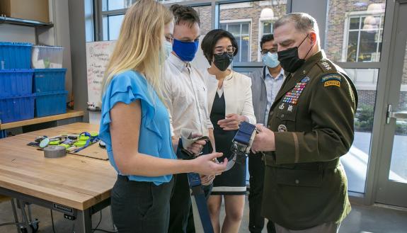 General Mark Milley, chairman of the Joint Chiefs of Staff, visits with students and professors in the Duke Engineering Wilkinson Building’s Christensen Family Center for Innovation. Representatives from the Design Health team Shock Value show Gen. Milley