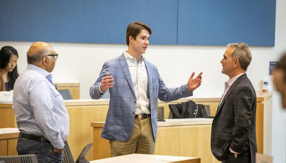 Haroon Inam, Michael Wood III and Brian Murray talk at the climate podcast discussion.