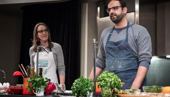 Duke Ph.D graduate Ashley Rose Young and chef Alon Shaya during a cooking demonstration. Photo courtesy of the Smithsonian's National Museum of American History.