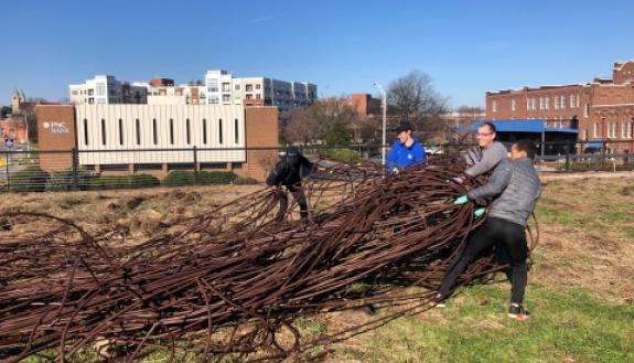 Volunteers assist with clean-up and preparation efforts for the Bull City Community Garden.