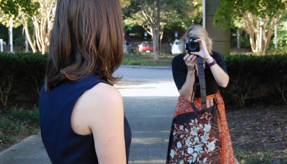 Erika Hanzely-Layko of the Duke Center for Child & Family Policy takes a portrait of co-worker Jennifer Copeland. Photo by Stephen Schramm.