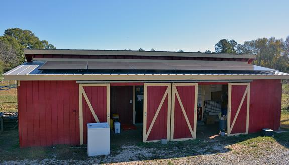 A dozen solar panels line the roof of Duke Campus Farm's barn. Photo by Jonathan Black.