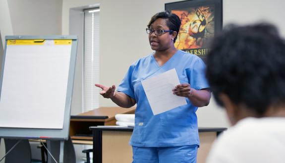 Duke quality assurance technician Karla Washington presents about pharmacy hand hygiene to Duke's Learning & Organization Development classmates.