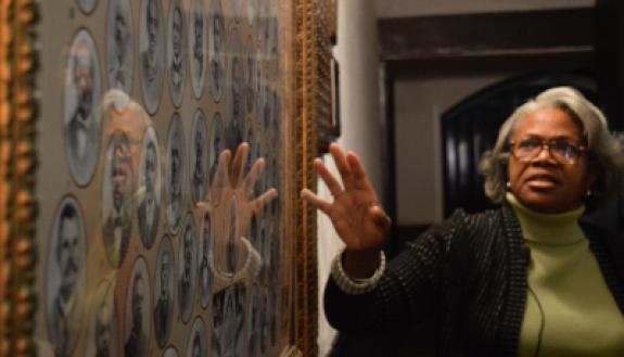 Wilmington historian Cynthia Brown gestures to an artwork at St. Stephen AME Church. (Huiyin Zhou)