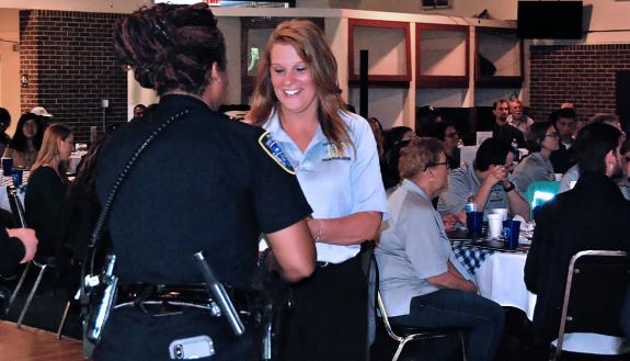 Duke University Hospital's Rhonda Tilley accepts her certificate after completing the Alumni Citizens' Police Academy on Friday. Photo by Stephen Schramm.