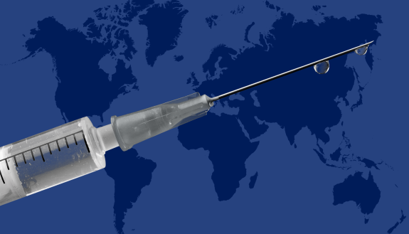 An image of a syringe in front of a world map.
