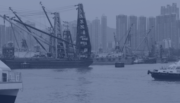 A picture of the Hong Kong harbor with cargo ships.