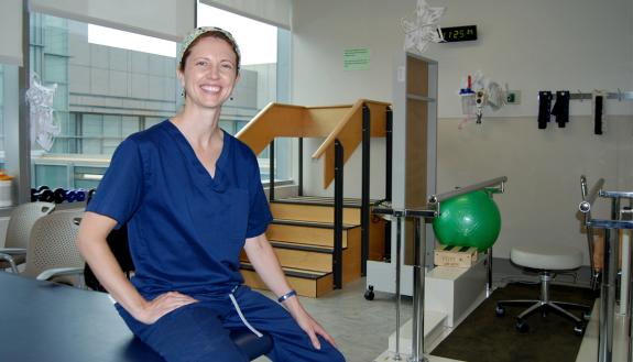 Dana Lott uses her upbeat attitude to helps patients endure challenging physical therapy. Photo by Stephen Schramm.