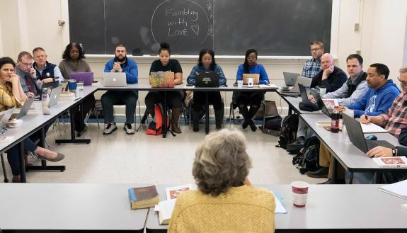 Duke employee Daniel Corpening, on the right side of the classroom in the blue shirt and vest, attends a class as part of the Duke Divinity School's Doctor of Ministry program. Photo courtesy of Duke Divinity School.