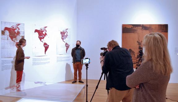 Two people filming a conversation.