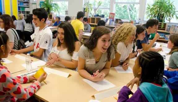 Duke student Catherine Oliver and other students in the Knowledge in the Service of Society FOCUS cluster work with students at Watts Elementary School. Photo by Susie Post-Rust.