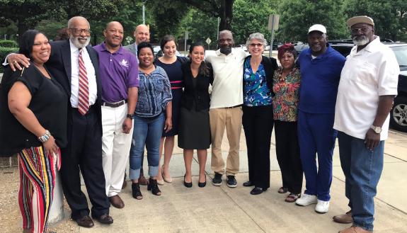 Jim Coleman, second from left, and Jamie Coleman, back row, stand with family members of Charles Ray Finch after he was released from prison in 2019 for a crime he did not commit. Photo courtesy of the Duke Law School.