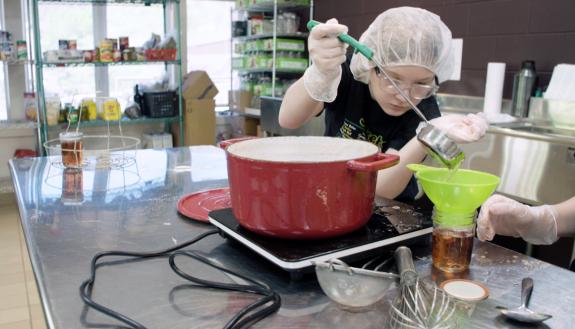 A volunteer works at the community canning operation organized by the Hindman Settlement School, a Kentucky nonprofit that received help from Duke Continuing Studies. Photo courtesy of Hindman Settlement School.