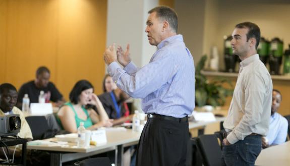 Jon Fjeld, center, addresses a Fuqua entrepreneurship workshop. Photo by Howie Rhee