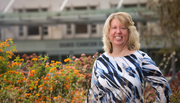 Donor and volunteer Heather Paradis in front of the Duke Cancer Center. Photo by Ken Huth.
