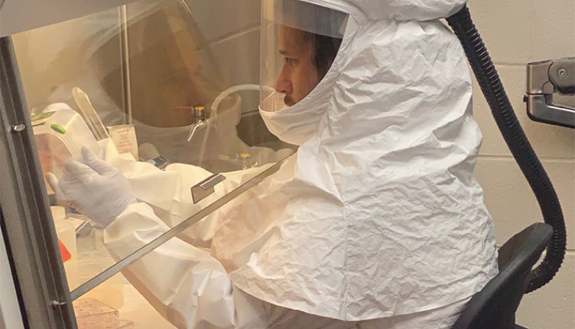 researcher working on CAOVID-19 materials