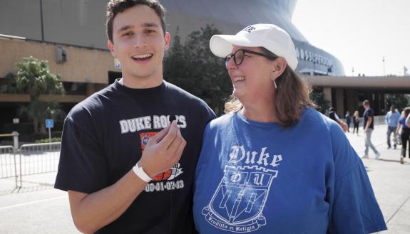 Legacy Grad Jimmy Rodríguez and his mother, Stacy Jordan Rodríguez, stand outside the Superdome in New Orleans