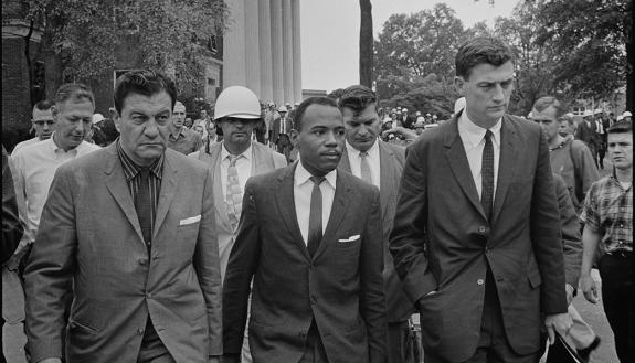 James Meredith walks to class at the University of Mississippi in 1962, accompanied by U.S. Marshal James McShane (left) and John Doar of the Justice Department. Photo by Marion S. Trikosko, U.S. News & World Report, via Wikimedia Commons.