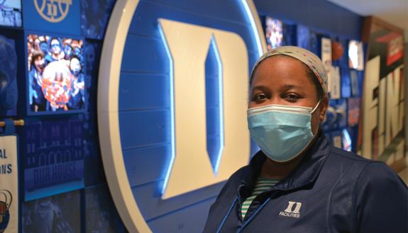 LaShawnda Harris of Duke University Environmental Services stands in Cameron Indoor Stadium. Photo by Stephen Schramm.